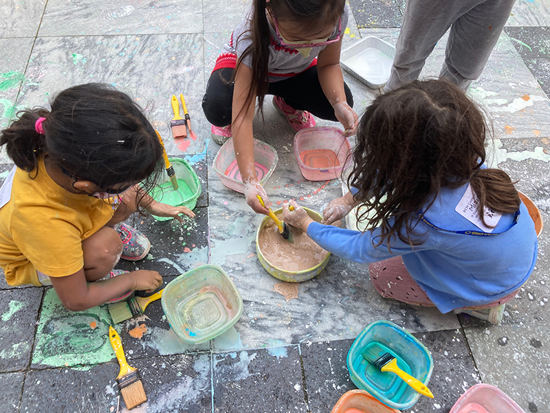 Children with sidewalk chalk